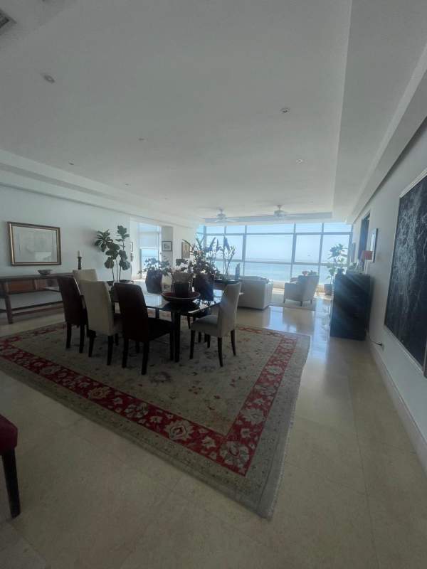 Living room with floor-to-ceiling windows and ocean view at Ten Tower Panama