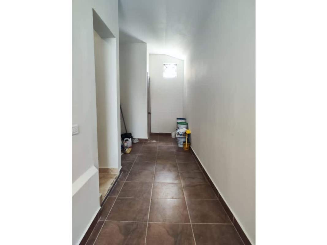 Large backyard garden with swimming pool and landscaping in Costa Sur house rental