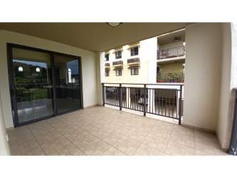 Covered furnished balcony with panoramic garden views in River Valley Panama Pacifico