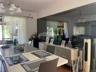 Dining room with large mirrored wall and open views to kitchen in Costa Blanca Villas Panama