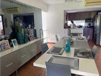 Open kitchen with granite countertops, wood cabinetry and appliances at Costa Blanca Royal Decameron villa