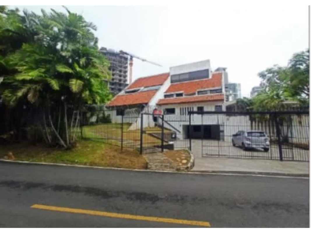 Luxury home living room with sloped wood ceilings and bright windows in Coco del Mar Panama