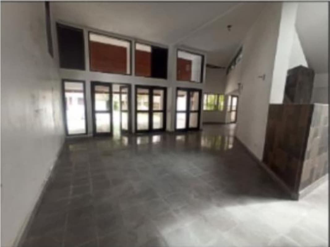 Spacious master bedroom with access to balcony and large windows in luxury Coco del Mar residence