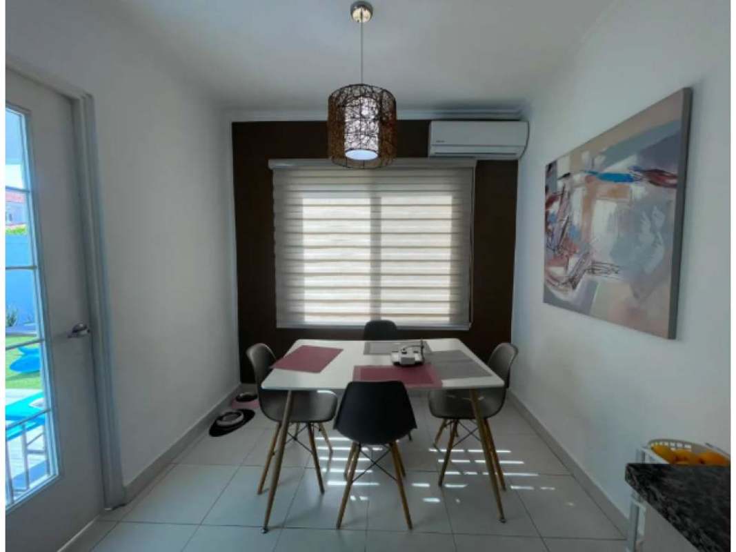 Spacious master bedroom with walk-in closet and balcony in Costa Sur home for sale