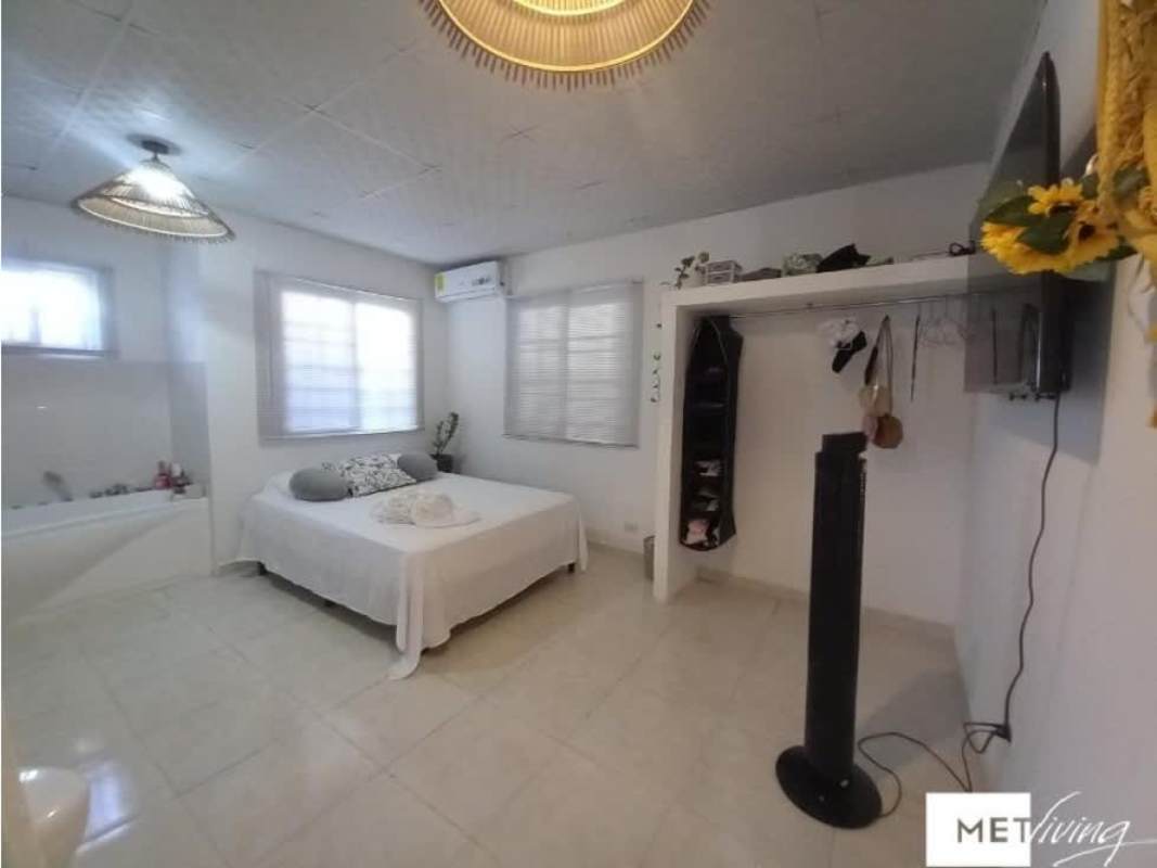 Spacious bedroom with large window, built-in AC and bathtub in Pacora house sale