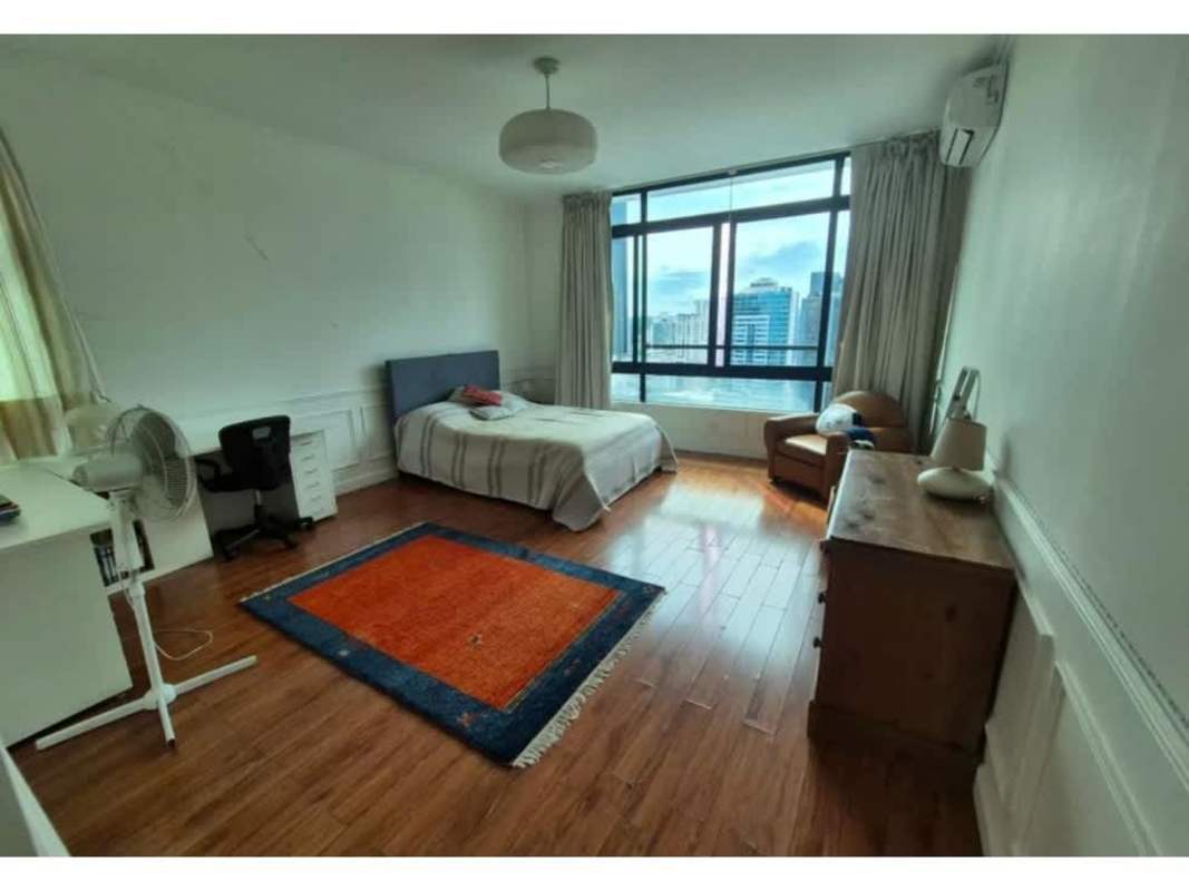 Spacious master bedroom wooden floor large windows city view PH Marbella penthouse Panama City