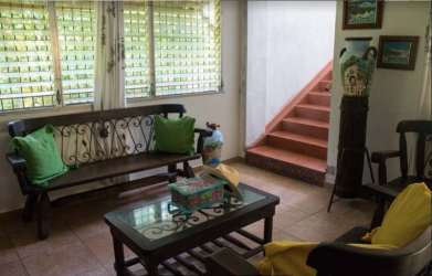 Kitchen with stone bar, wooden cabinets vacation house Costa Esmeralda Panama