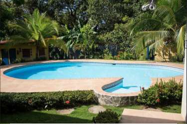 Pool with tropical landscaping at vacation home Costa Esmeralda San Carlos Panama