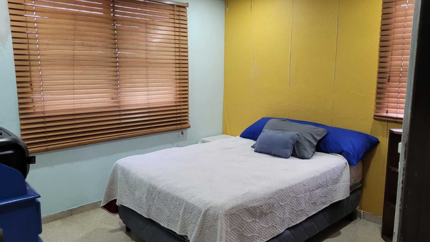 Outdoor patio with artificial green hedge wall in Altos de Panamá furnished home for rent