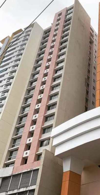 Exterior of tall Aurora Tower condo building with modern balconies in El Cangrejo Panama