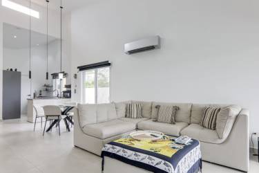 Bright bedroom overlooking gardens with large closet in San Carlos beach house Panama