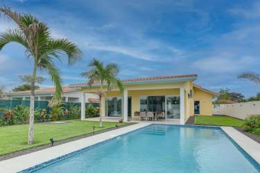 Covered patio terrace perfect for outdoor dining with pool and garden views in San Carlos Panama