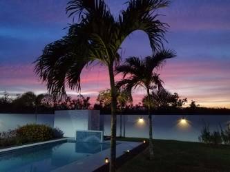 Bright bedroom with access to pool patio in San Carlos beach property Panama