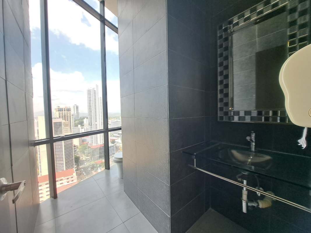 Elegant bathroom with glass walls and skyline view office in Torre Generali Obarrio Panama