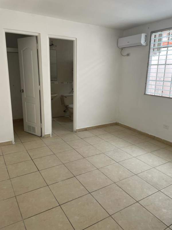 Bedroom with tiled floors and wardrobe in Brisas del Golf house for sale Panama