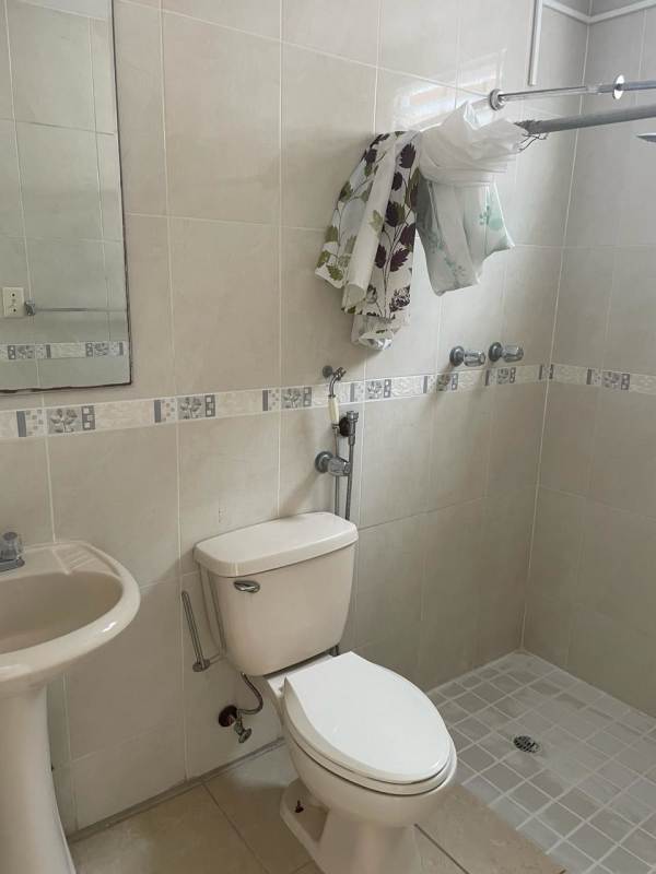 Front of house with covered carport in secure gated neighborhood Brisas del Golf Panama