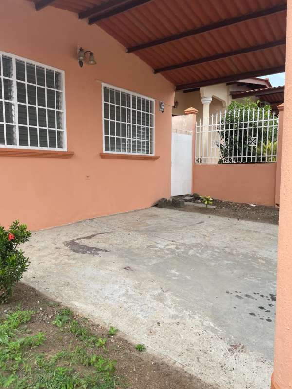 Covered parking area with gate in house for sale Brisas del Golf Panama