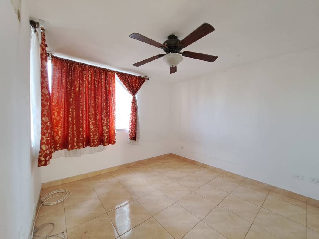 Traditional bathroom with tiled walls, walk-in shower, vanity and mirror in PH Sunset Place Panama City