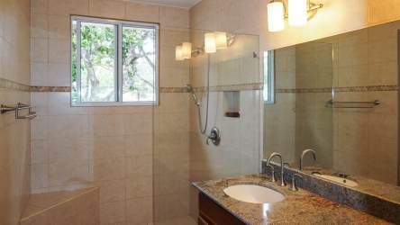 Spacious bedroom with vaulted ceilings, garden views, and balcony access El Valle Panama