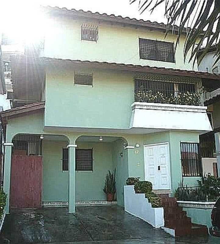 Traditional kitchen with stainless steel fridge open to dining in Hato Pintado Panama