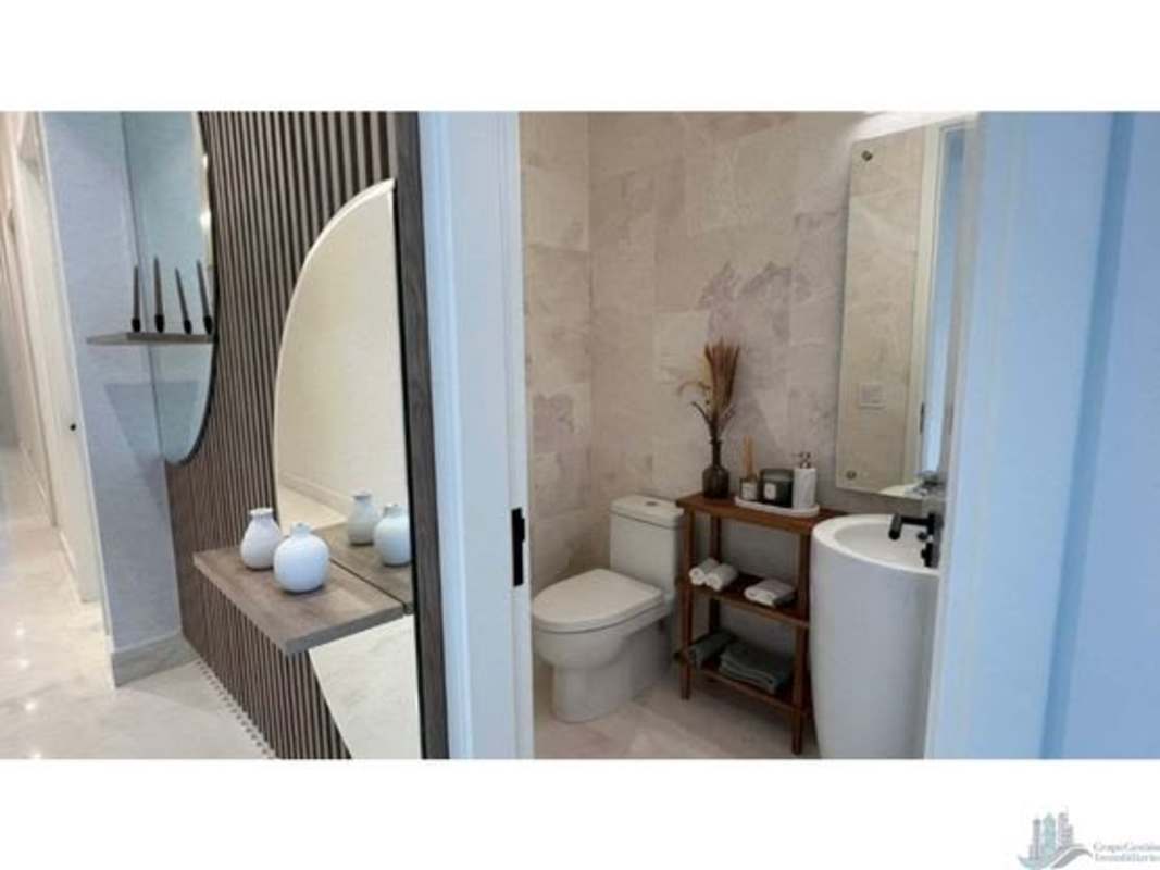 Covered patio with outdoor dining and lounge area overlooking private garden Ocean Reef Panama