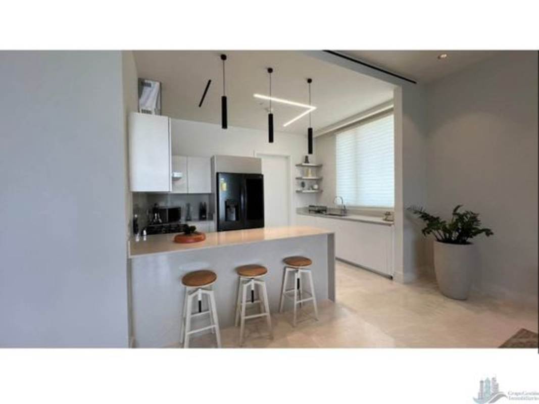Contemporary kitchen island with pendant lighting Ocean Reef Islands luxury condo Panama City
