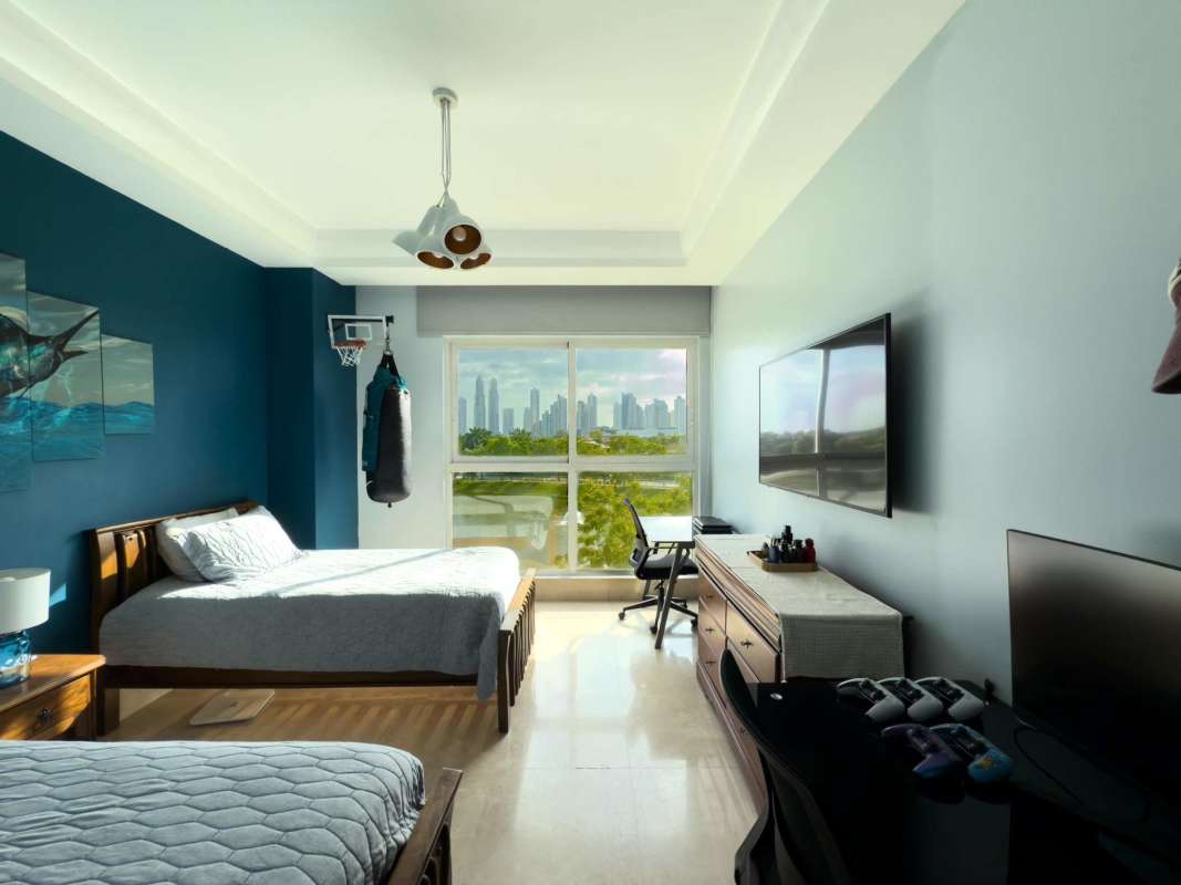 Spacious living room with sliding glass doors to balcony golf view at Privilege Tower Panama