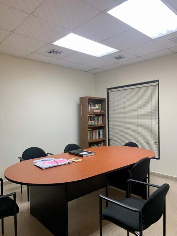 Private meeting room inside office at Aventura Business Center with modern furnishings in Panama City