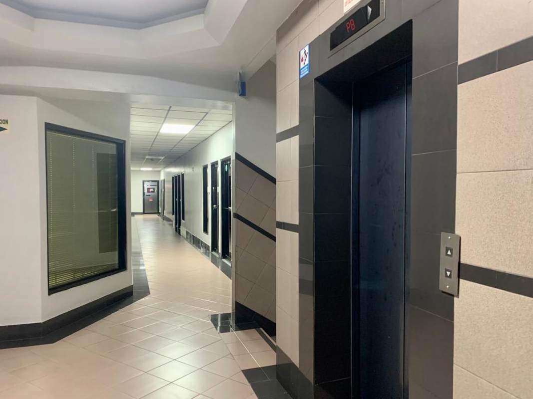 Commercial building interior corridor and elevator lobby at Aventura Business Center Panama City