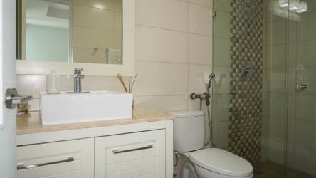 Penthouse master bedroom featuring large windows with ocean and mountain views Rio Mar Beach Resort Panama