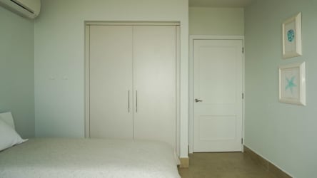 Upscale open kitchen with granite countertops island and stainless steel appliances Rio Mar penthouse Panama