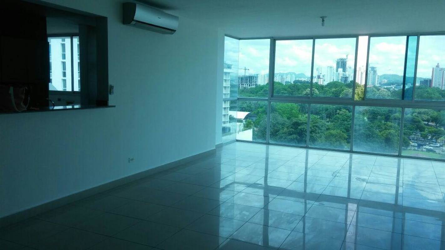 Modern high-rise condominium with balconies and skyline views in Panama City