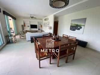 Bright living and dining room with balcony ocean view at PH Balboa Bijao Panama