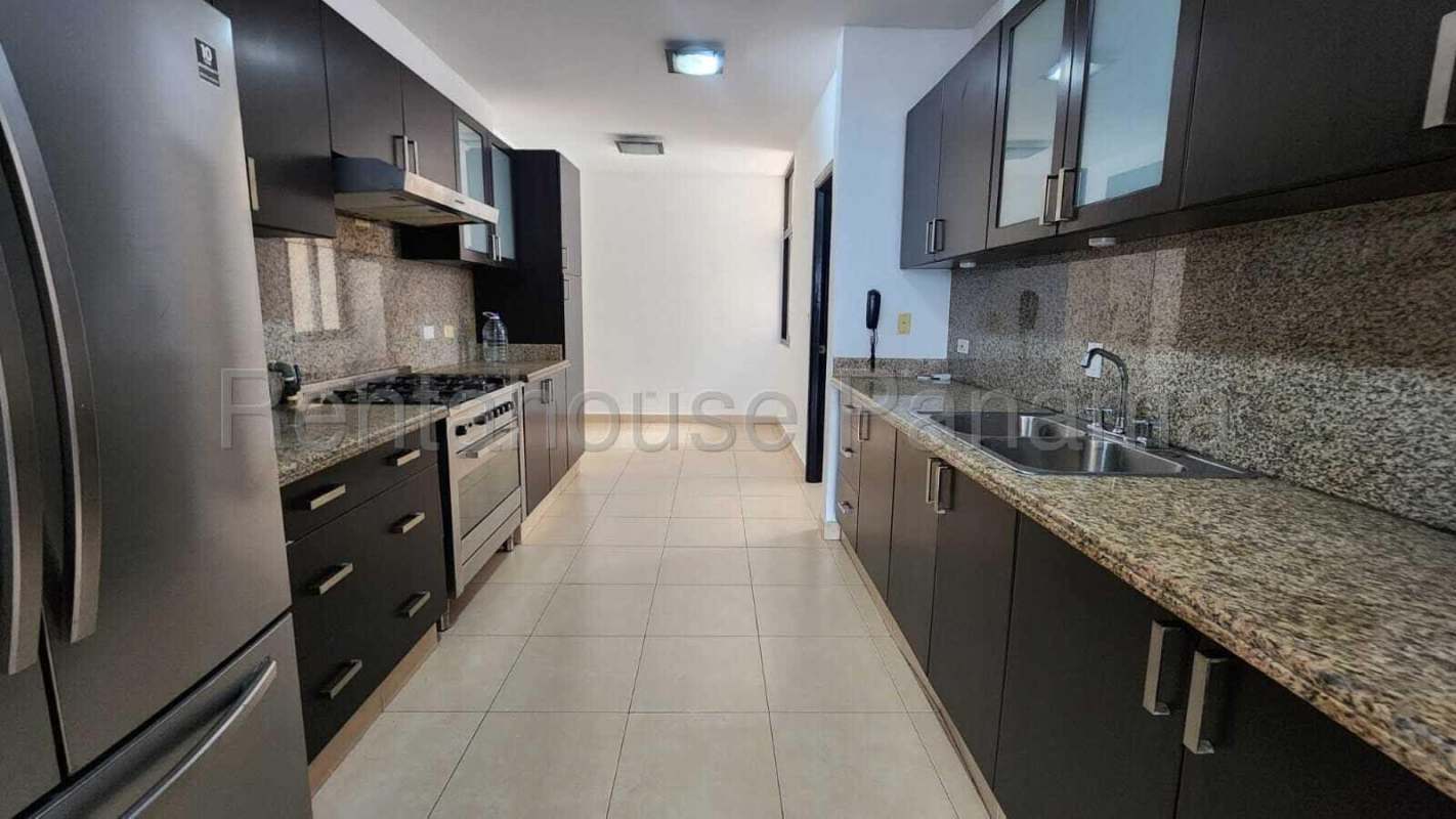 Contemporary bathroom with glass shower and marble sink in PH Costa del Este Panama City