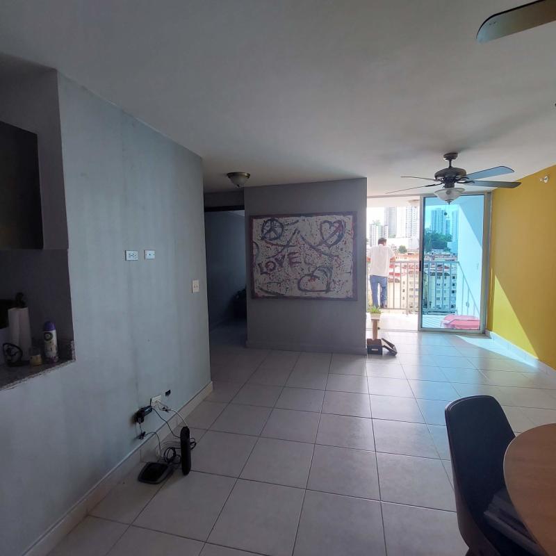 Open living dining room with balcony access and modern finishes apartment near Parque Omar Panama