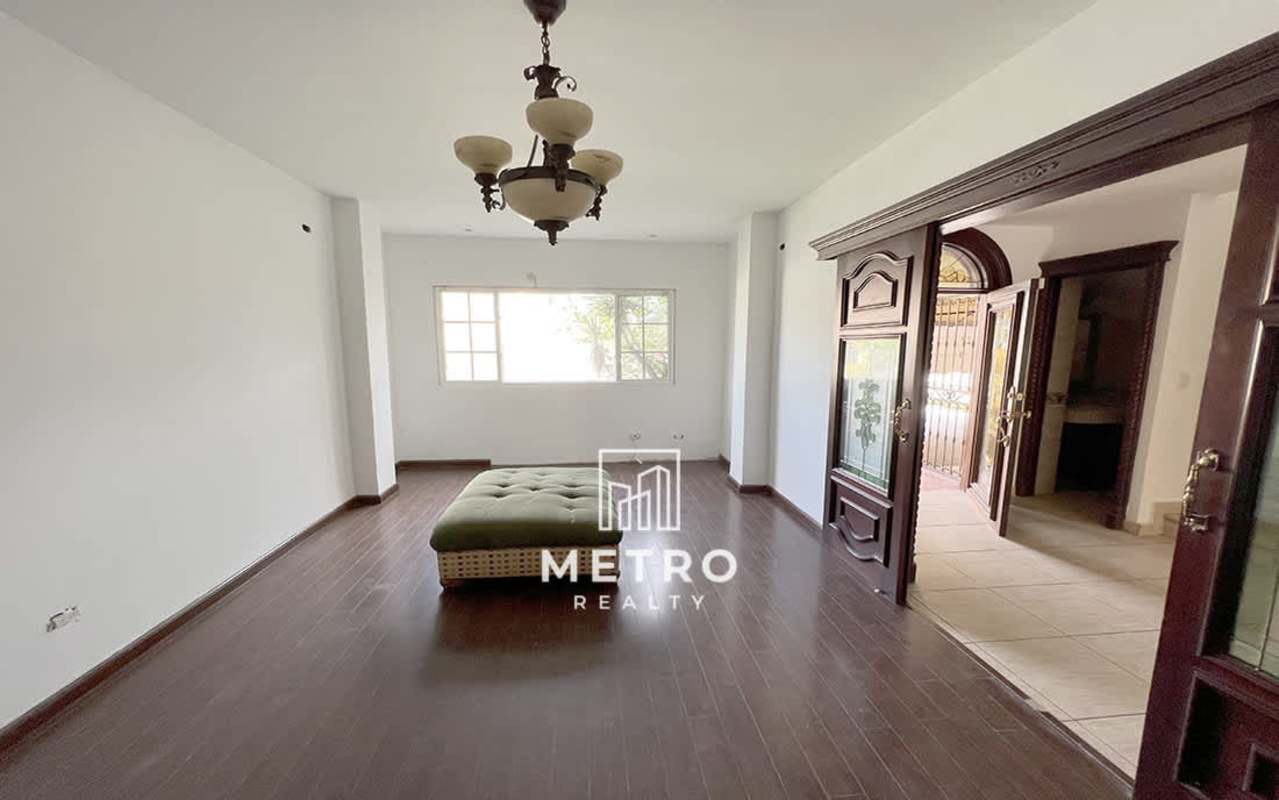 Outdoor patio terrace with swimming pool and landscaped garden in family home at Costa del Este Village Panama City