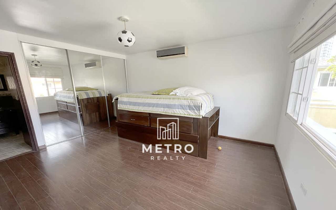 Spacious modern kitchen with granite countertops and ample cabinets in Costa del Este family house Panama City