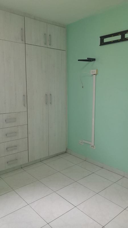 Exterior view of Villa Margarita apartments with gated entrances and parking in Parque Lefevre Panama City