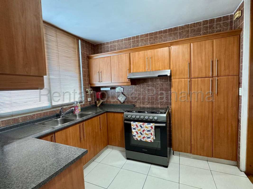 Open living dining room with wood floors, city view windows PH Mont Royale El Cangrejo Panama