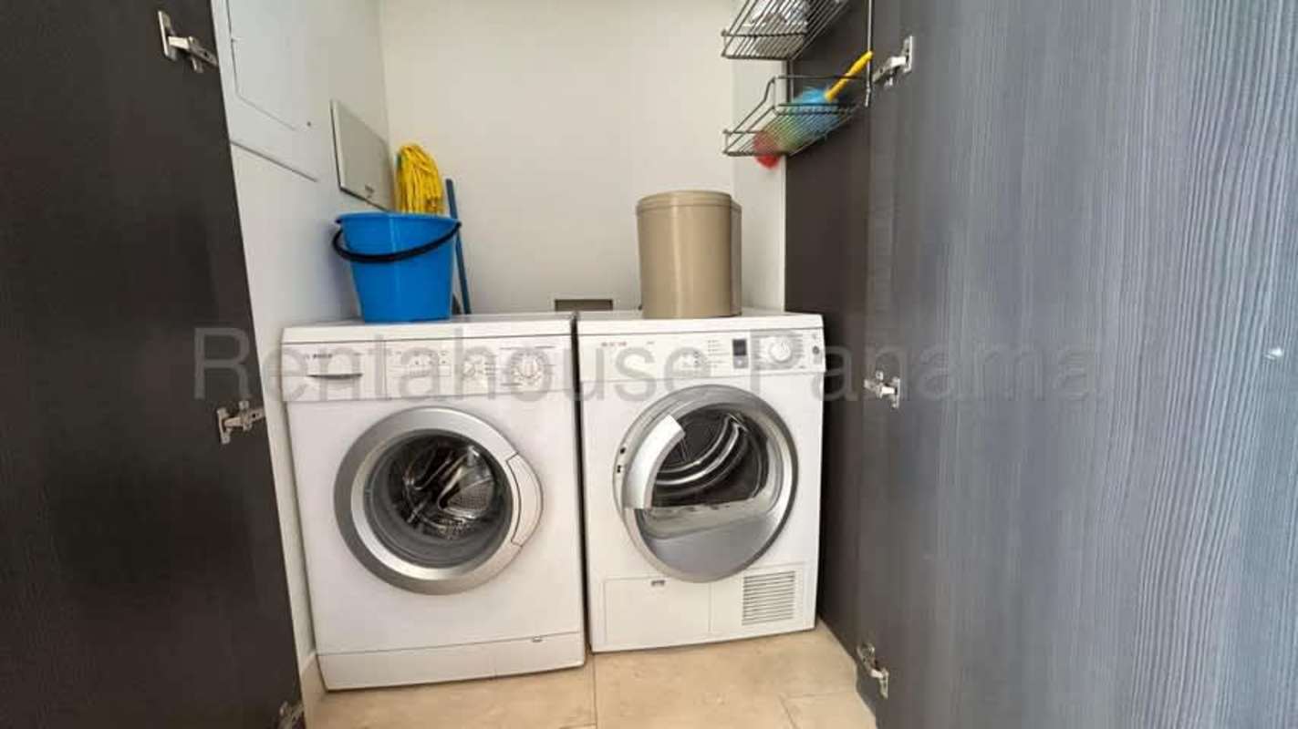 Primary bedroom with walk-in closet and balcony access overlooking ocean JW Marriott Panama