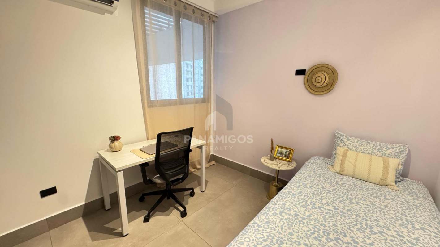 Bedroom in PH Victory Sport apartment with large window and city view in Coco del Mar Panama