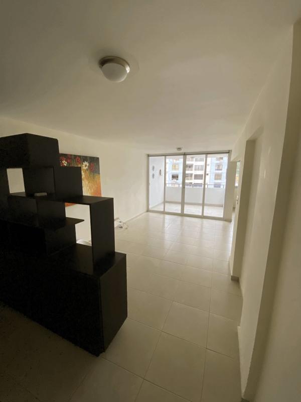 Open living and dining space with large windows urban apartment in Villa de las Fuentes Panama