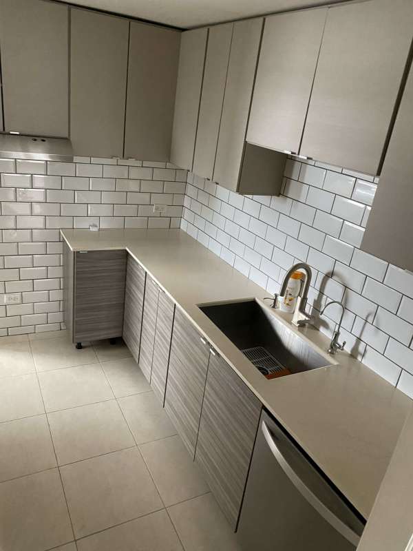 New kitchen with white subway tile and quartz countertops PH Villa de las Fuentes Panama