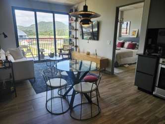 Modern bathroom with glass enclosed shower, vanity and neutral tones in PH Centriqo