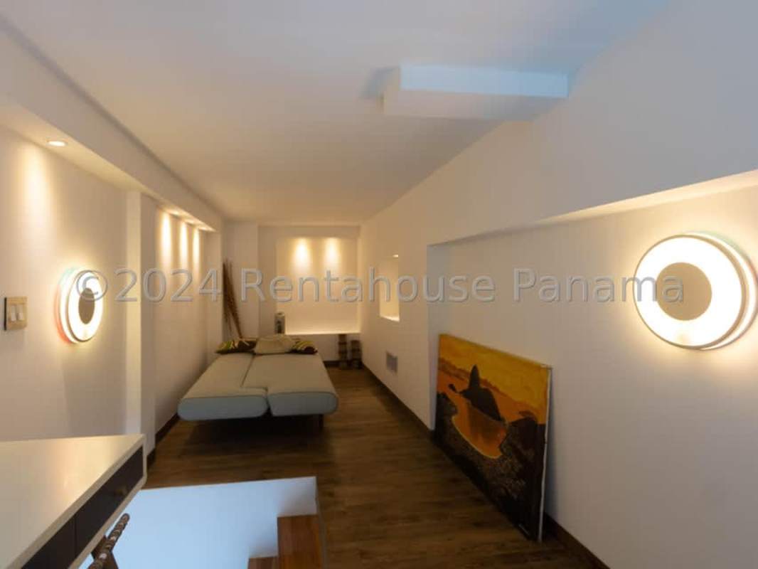 Bright guest bedroom with large window city view at Destiny Tower Panama