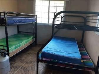 Bedroom with tiled floor, window, rural countryside home Anton Panama