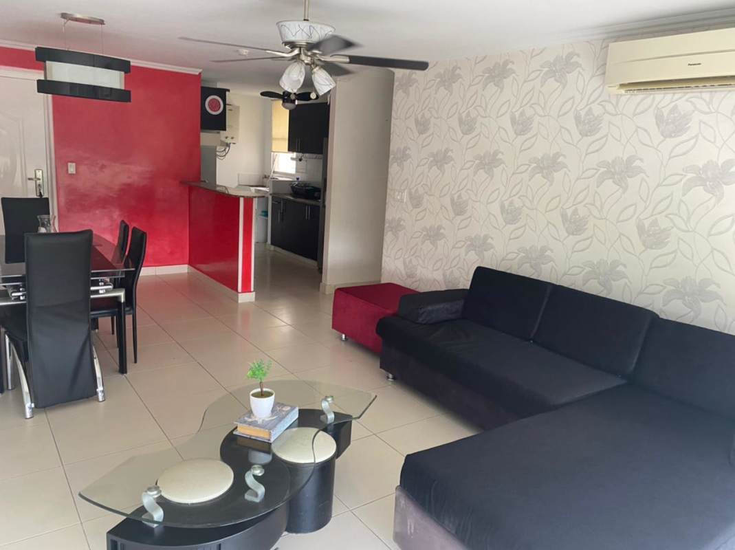 Open kitchen with granite counters connecting dining room furnished at PH Victory Panama