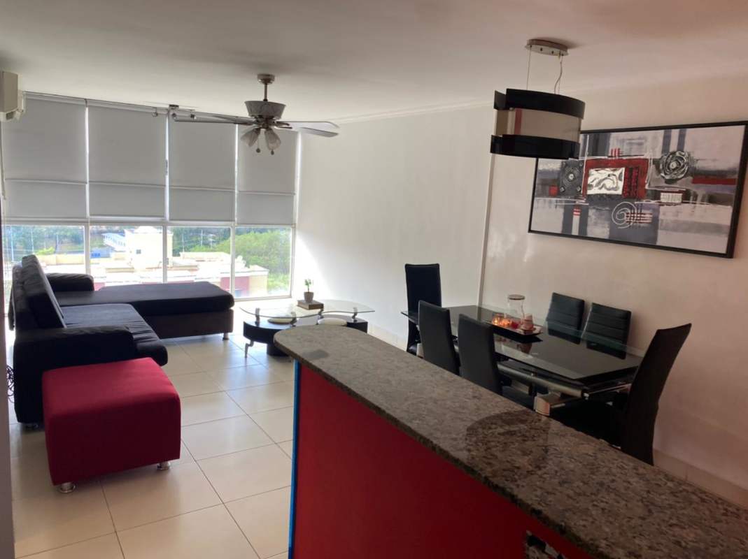 Living dining room furnished with large windows at PH Victory Condado del Rey Panama for sale