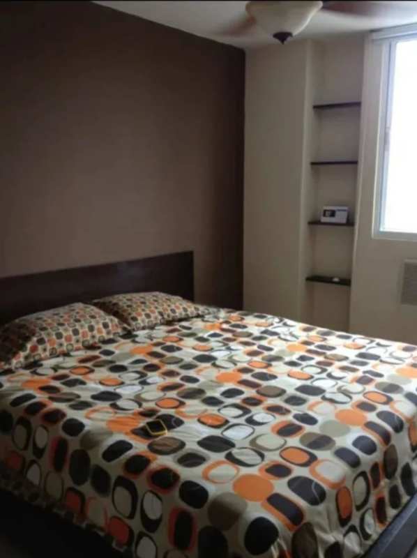 Bedroom with accent wall, built-in shelving, large window in PH Marbella 47 El Cangrejo Panama