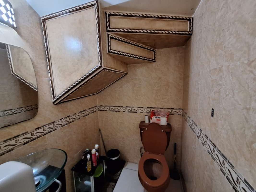 Contemporary kitchen with cabinets, appliances and window light at PH Villas del Naranjal Pedregal Panama